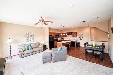 West Des Moines townhouse for rent - a living room with a couch and a table