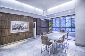 Toronto apartment for rent - Renovated social room with table and chairs
