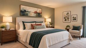 Randallstown apartment for rent - A bedroom with a large bed and a painting on the wall.