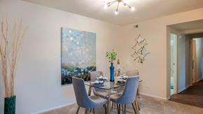 Randallstown apartment for rent - a dining room with a glass table and chairs