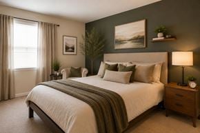 Temple Hills apartment for rent - A bedroom with a large bed and a painting on the wall.