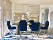 Rahway apartment for rent - a dining room with blue chairs and a wooden table