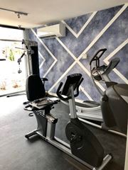 Rahway apartment for rent - a gym with some exercise machines in it