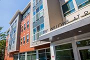 Rahway apartment for rent - a large building with a sign that reads the willows apartments