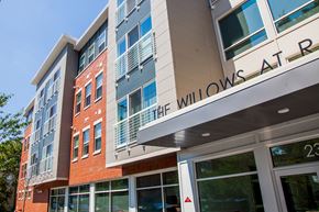 Rahway apartment for rent - a large building with a sign that reads the willows apartments