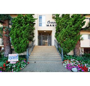 Los Angeles apartment for rent - the front of a building with stairs and a sign