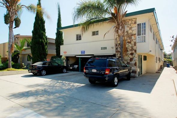 Los Angeles apartment for rent - two cars parked in front of a building