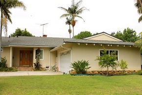 Los Angeles apartment for rent - A house with a brown door and a white garage door.