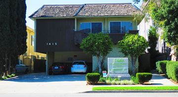 Los Angeles apartment for rent - the front of a house with two cars parked in the driveway