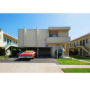 Los Angeles apartment for rent - a red car parked in front of a building