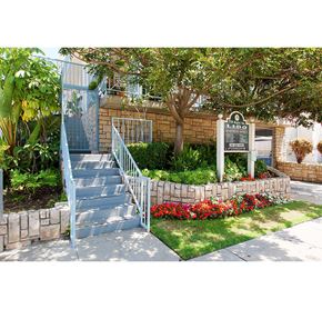 Los Angeles apartment for rent - a staircase in front of a house with a sign