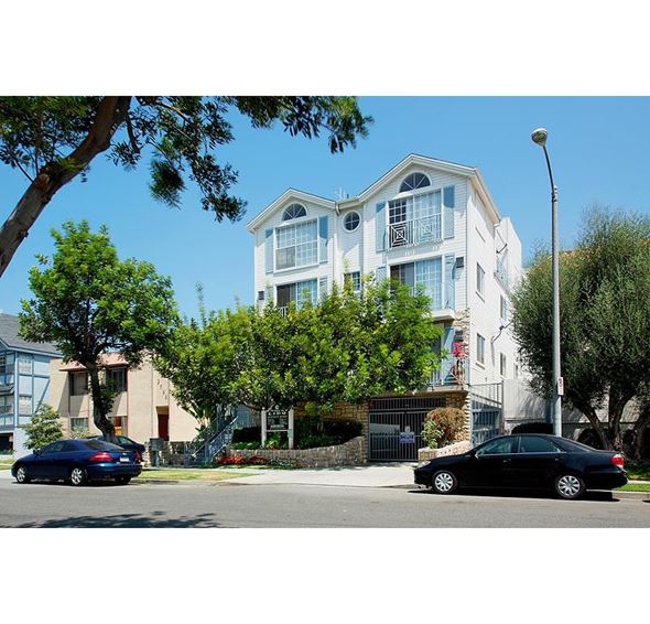 Los Angeles apartment for rent - two cars parked in front of an apartment building