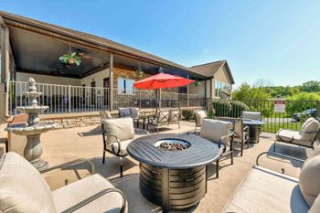 Outdoor lounge area including several fire pits