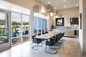 Pittsburgh apartment for rent - A modern dining room with a long table and chairs.