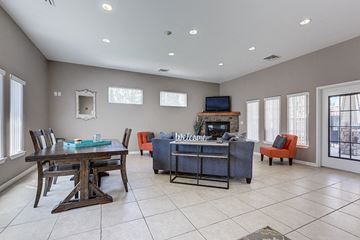 Spokane apartment for rent - a large living room with a table and chairs