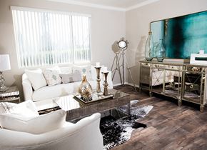 Rocklin apartment for rent - A living room with a white couch and a wooden floor.