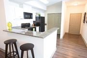 Atlanta apartment for rent - Fitted Kitchen With Island Dining at Monroe Place Apartments, Atlanta, GA, 30324