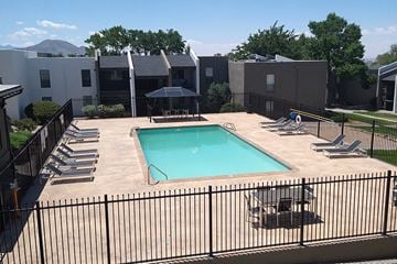 Albuquerque apartment for rent - A black fence surrounds a small pool.