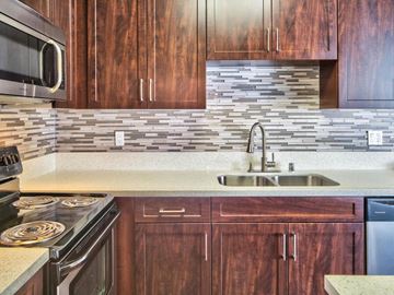 Valley Village apartment for rent - a kitchen with wooden cabinets and a sink