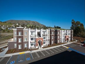 San Luis Obispo apartment for rent - an aerial view of an apartment complex with a mountain in the background