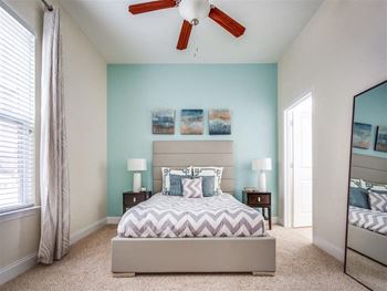Beautiful bright bedroom with wide windows