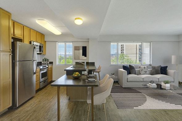 Denver apartment for rent - a kitchen and living room with stainless steel appliances and a table