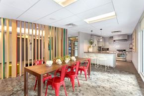 Denver apartment for rent - a dining room with a wooden table and red chairs