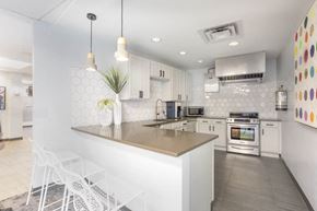 Denver apartment for rent - a kitchen with white cabinets and a counter top