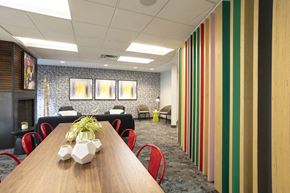 Denver apartment for rent - a conference room with a wooden table and chairs
