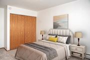 Bloomington apartment for rent - a bedroom with a bed and a closet