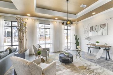St. Louis apartment for rent - a living room with couches and chairs and a table
