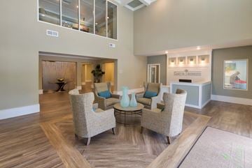 Milton apartment for rent - a living room with couches and chairs and a table