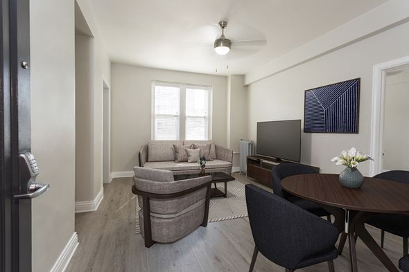 Denver apartment for rent - a living room with a couch and a table