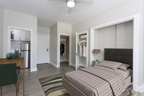 Denver apartment for rent - a bedroom with a bed and a closet