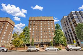 Denver apartment for rent - a view of an apartment building on a city street