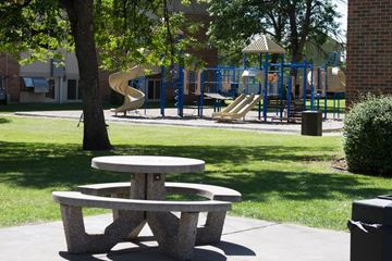 Grand Forks apartment for rent - A playground with a slide and a picnic table.