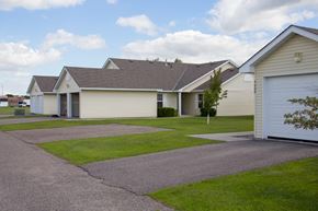 Grand Forks apartment for rent - A house with a driveway in front of it.