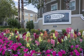 Stafford apartment for rent - A sign for Estates at Fountain Lake is surrounded by flowers.