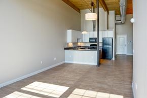 Lowell apartment for rent - A kitchen with a refrigerator, stove, and oven is shown.