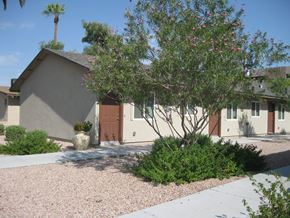 Scottsdale apartment for rent - a house with a driveway and a tree in front of it