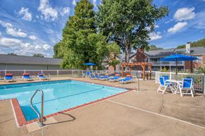 Virginia Beach apartment for rent - Large pool with sunbathing chairs and tables at St. Croix Apartments in Virginia Beach VA