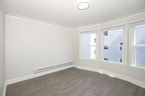 San Francisco apartment for rent - A room with a window and a radiator on the wall.