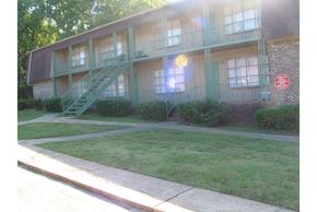 Tuscaloosa apartment for rent - A building with a red sign on it.