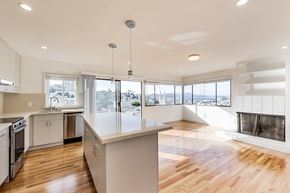 San Francisco apartment for rent - A modern kitchen with wooden floors and a large island.