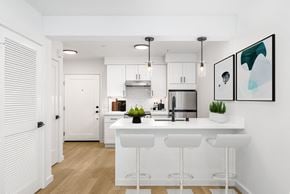 San Francisco apartment for rent - a kitchen with a large island and white cabinets