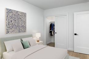 San Francisco apartment for rent - a bedroom with a white bed and a blue painting on the wall