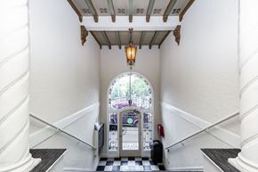 San Francisco apartment for rent - A white staircase with a black and white checkered floor.