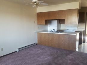 Kalispell apartment for rent - Image showing kitchen from a distance and baseboard heater