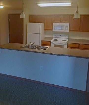 Missoula apartment for rent - an empty kitchen with a counter and a sink