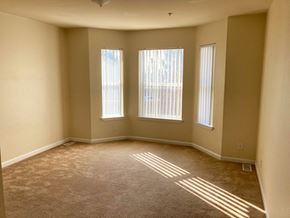 Bakersfield apartment for rent - Image of room with large windows and a floor heater